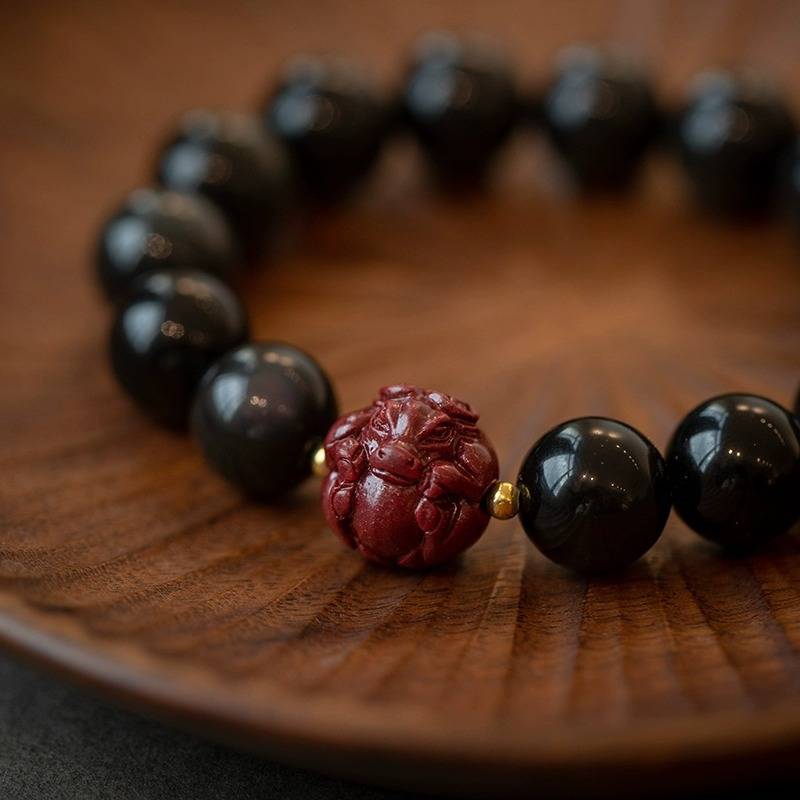 Obsidian and Cinnabar bracelet featuring the Twelve Chinese Zodiac signs for attracting good luck, protection, Buddhist guardianship, and health2